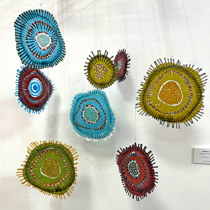 Fused glass works by Rachael Durkan featuring hanging cell forms.