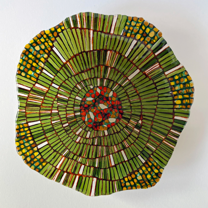 A fused glass artwork of a tree cell measuring 30cm diameter.