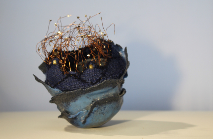 Mixed media sculpture using pate de verre glass and textiles