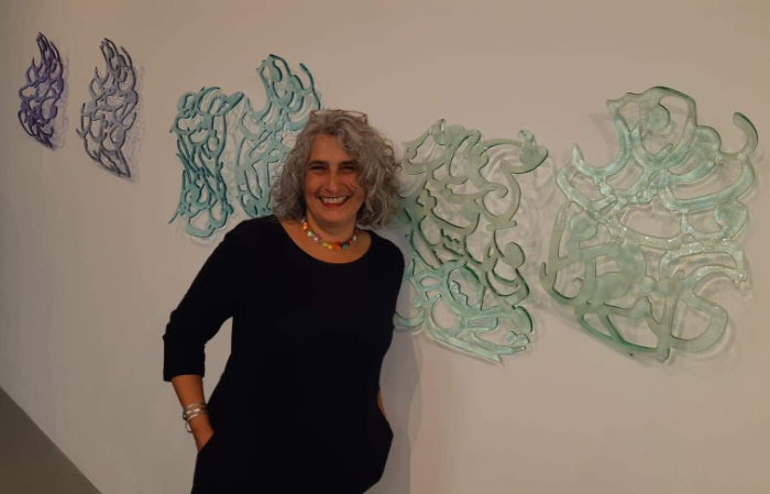 Glass artist Hassina Khan with her wall art 'Hybridity. Do Not Ask'