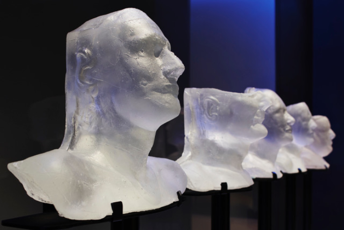 Detail of 'Silent Stories' cast glass head installation at the Science Museum in London