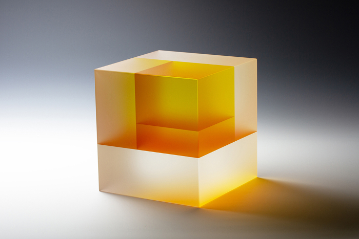 Coldworked glass sculpture in orange tones by Jiyong Lee