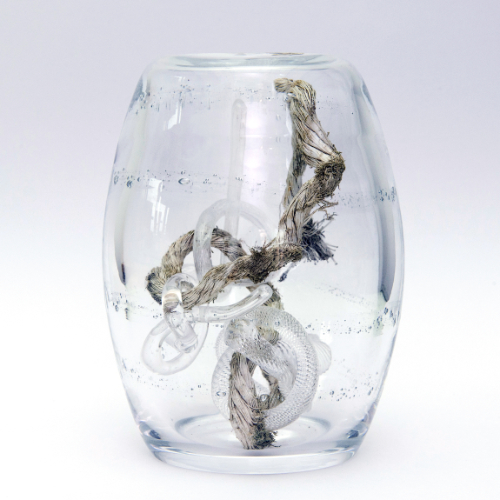 Blown glass barrel containing three glass knots and rope found at Lybster.