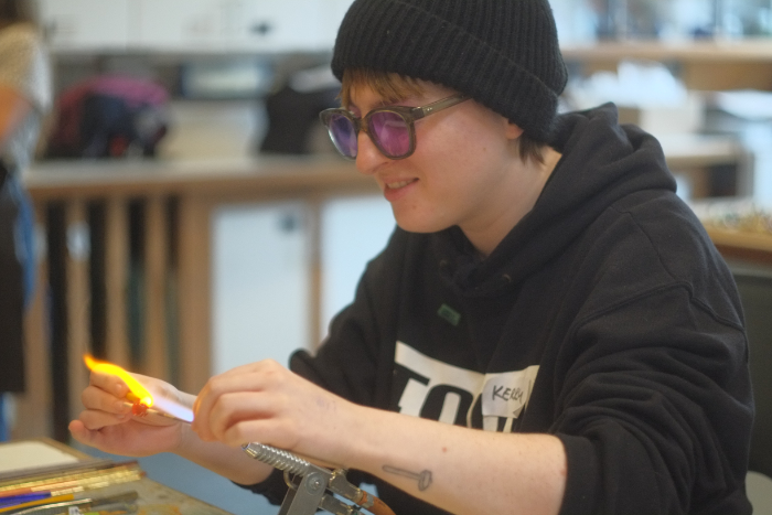 Kerry Collison lampworking in the studio.