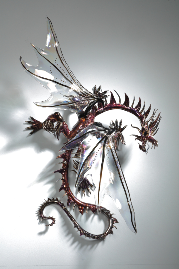 Glass wall art dragon sculpture made using flame working technique, which won the Young Collectors' award at the British Glass Biennale in 2022.
