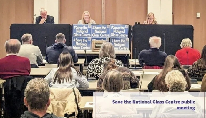 Three members of the campaign to save the national glass centre on stage presenting during a public meeting at City Hall in Sunderland.