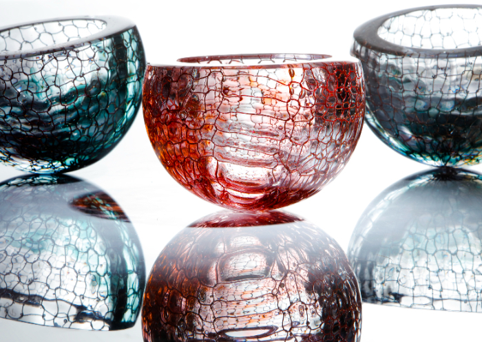 Blown glass bowls featuring knitted copper inclusions within the glass in the Del Mar series by Emmy Palmer.
