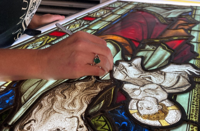 Close-up view of conservation painting of a stained glass window at the Stained Glass Museum at Ely Cathedral.