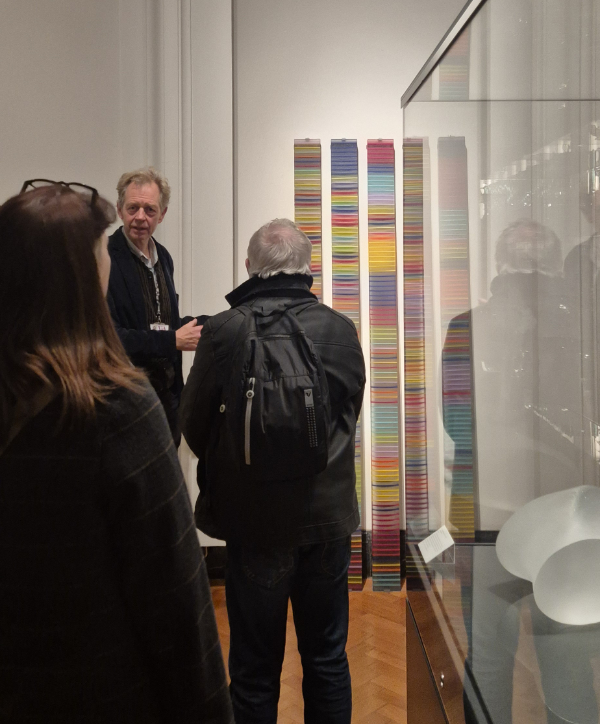 Reino Liefkes, senior curator of glass and ceramics at the V&A, showing visitors the museum's glass collection.