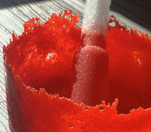 Close up of pestle and mortar made from pate de verre glass.