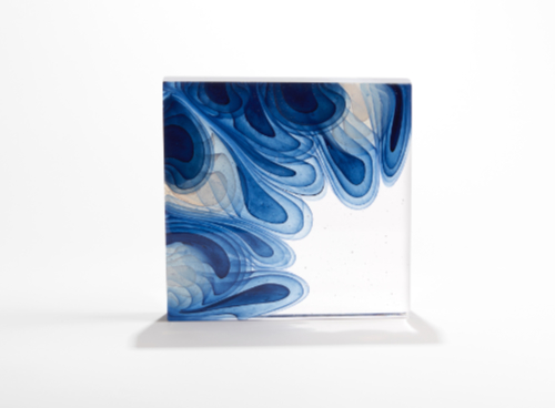'Blue Interaction' by Helen Restorick is a square glass sculpture featuring swirls of blue and white glass in different tones.