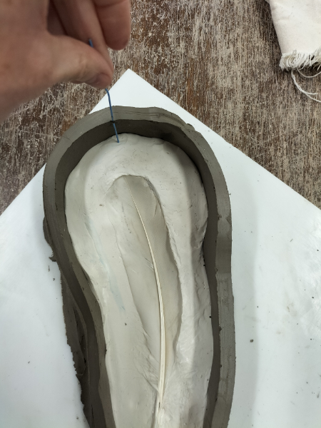 Casting a feather in glass.