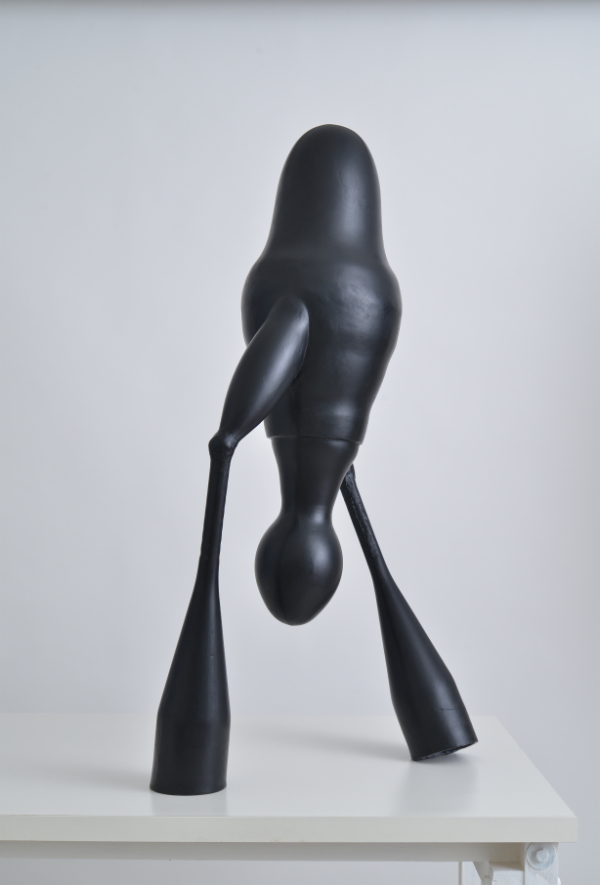 Abstract humanoid black figure standing just over 1m high and made from moulded acrylic gypsum fibre glass.