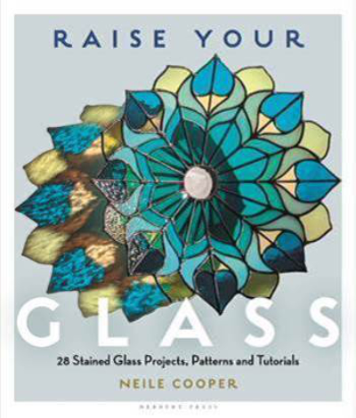 Cover image of Raise Your Glass book featuring stained glass peacock style dish in turquoise and greens.