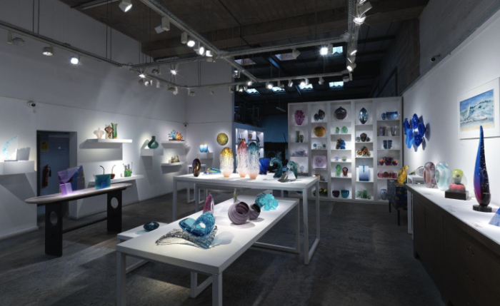 A view across London Glassblowing gallery showing many different pieces of glass art