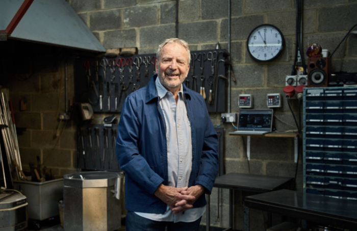 Peter Layton standing in his glass studio