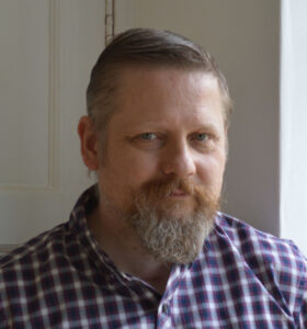 Portrait of stained glass artist Petri Anderson.